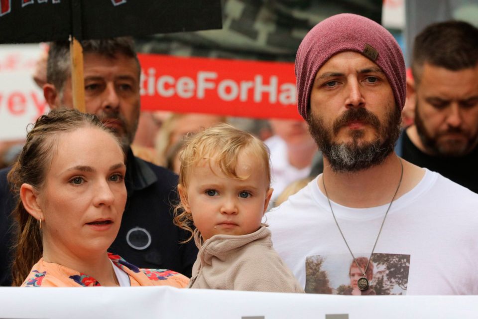 Harvey Morrison Sherratt's parents, Gillian and Stephen, with son Remy on the Justice for Harvey march. Photo: PA